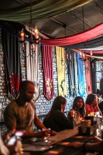 At the Game of Thrones pop-up in Washington, DC, house banners drape one of the rooms. | Photo by Farrah Skeiky.