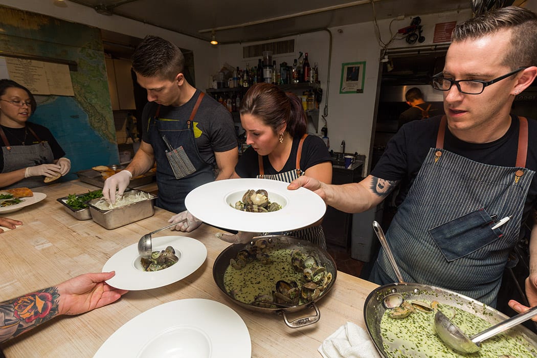 Chef James Rigato serves up clams with green curry.