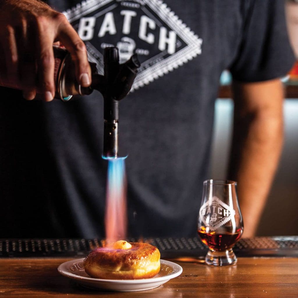 a whiskey and a Crème Brûlée doughnut at Batch